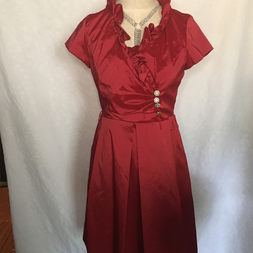 Red Satiny knee length with bling bottom.